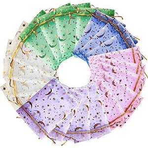 May include: A set of 15 sheer organza gift bags with a gold glitter moon and star pattern. The bags are in four colors: white, light purple, light pink, and green.