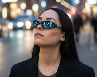 Vintage Oakley solglasögon med blå iridiumlinser och svarta bågar, sportiga omslutande glasögon