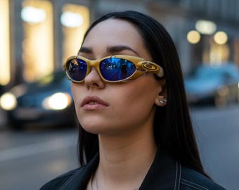 Vintage Oakley solglasögon guldbågar blå linser Oakley Archive sällsynta samlarobjekt