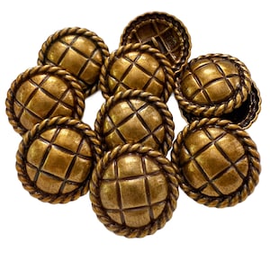 May include: A collection of antique gold-toned buttons. Each button features a diamond pattern within a rope-like border. The buttons are round and have a slightly domed shape, with a vintage aesthetic.