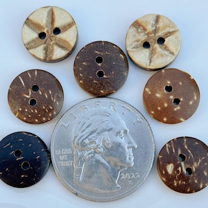 May include: A collection of seven round coconut shell buttons in various shades of brown, with two or three holes each. One quarter coin is included for size comparison. The buttons have natural wood grain patterns.
