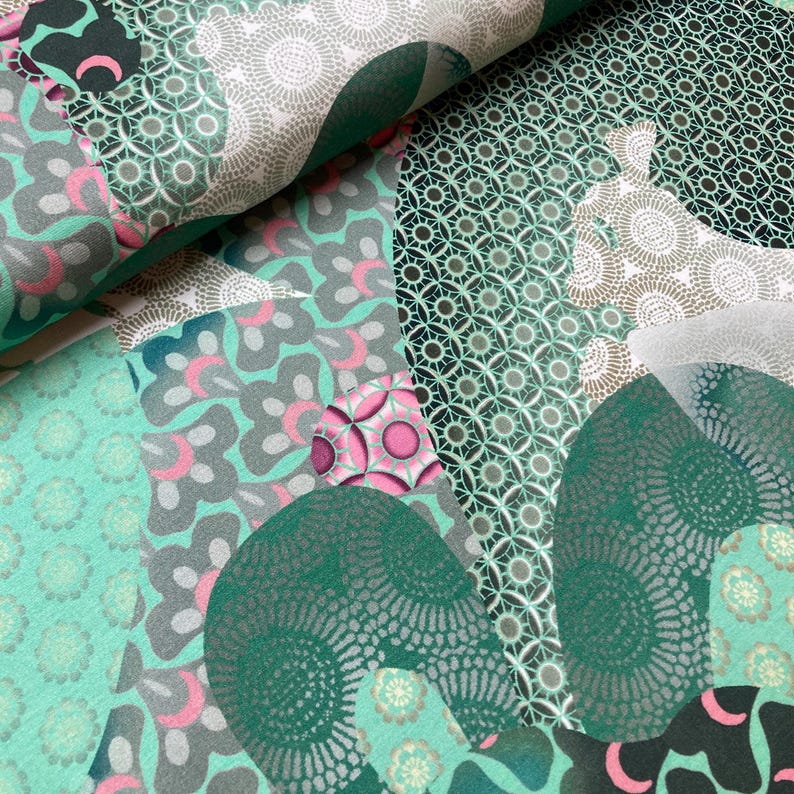 May include: A green and white fabric with a geometric pattern. The fabric features a variety of shapes and designs, including circles, squares, and triangles. The fabric is made of a soft, comfortable material and is perfect for a variety of projects.