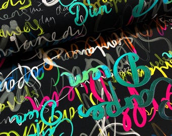 DIEM printed viscose jersey | OTTOBRE design® | colorful printed words on black jersey | Made in EU | Oekotex-100 certified