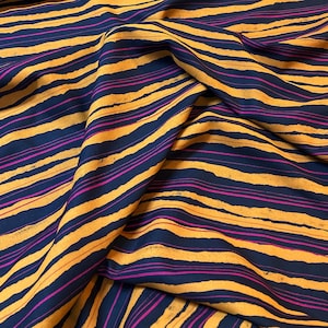 WAVES viscose fabric | OTTOBRE design®  | print in dark blue, ochre and pink stripes | Lenzing EcoVero viscose fibers