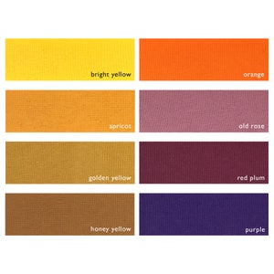 Puede incluir: Una carta de colores con ocho muestras de tela. Las muestras están dispuestas en dos filas de cuatro. La fila superior muestra amarillo brillante, naranja, albaricoque y rosa viejo. La fila inferior muestra amarillo dorado, ciruela roja, amarillo miel y morado.