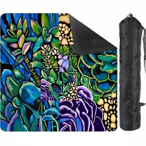 May include: A yoga mat with a vibrant, colorful succulent design in shades of blue, green, purple, and yellow. The mat is rolled out, with a black underside visible. A black carrying bag with a shoulder strap is next to the mat.