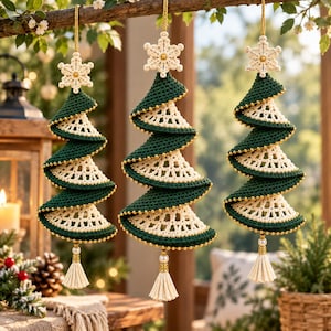May include: Three hanging Christmas tree ornaments crafted from dark green and cream-colored yarn. Each spiral tree features a crocheted snowflake topper, gold bead accents along the edges, and a cream-colored tassel hanging from the bottom.
