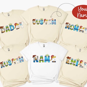 a group of t - shirts with the word family printed on them