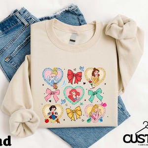 a pair of jeans and a t - shirt on a bed