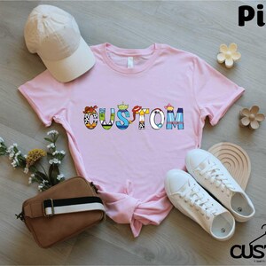 a pink shirt with the word autism on it