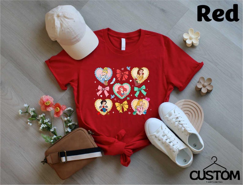 a red t - shirt with hearts and bows on it