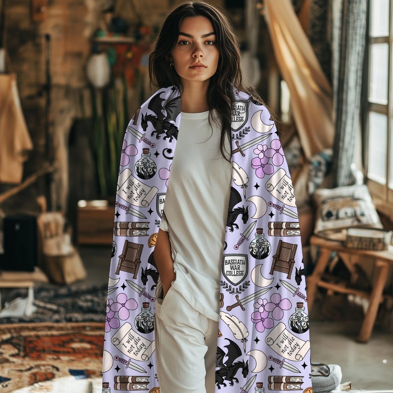 May include: A light purple blanket with a repeating pattern of black dragons, swords, potion bottles, and the text "I will not die today." The blanket also features the text "Basgiath War College."