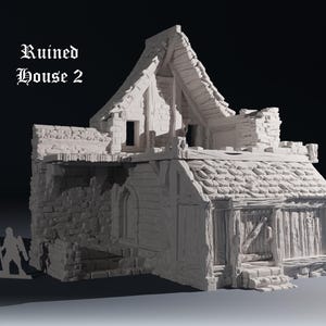 May include: A detailed, white miniature of a ruined house, featuring a weathered wooden door, stone walls, and a partially collapsed roof. The text "Ruined House 2" is displayed on the upper left. A miniature figure stands beside the house.