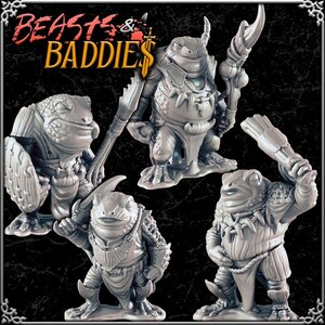 May include: Four gray fantasy frog figurines in various poses, some holding weapons and shields. The text "BEASTS & BADDIES" is displayed in orange and white at the top of the image. The figurines are detailed and appear to be miniature sculptures.