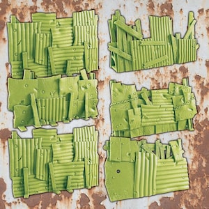 May include: Four green, corrugated metal and wood terrain pieces. The pieces are arranged in a square, each with a unique design of overlapping panels and wooden supports. The background is a rusty, textured surface.