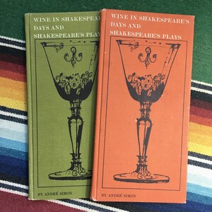 May include: Two green and orange hardcover books titled "Wine in Shakespeare's Days and Shakespeare's Plays" by Andre Simon. Each book features a black and white illustration of a wine glass.