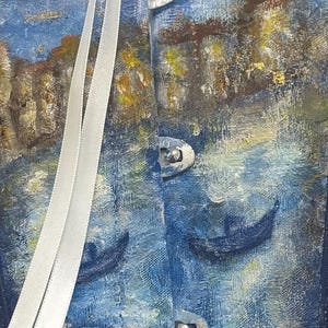 May include: A corset featuring a textured, painted scene of blue water with dark boat silhouettes and golden architectural elements. The garment includes three silver-toned metal front busk closures and two long, smooth white ribbon laces hanging vertically.