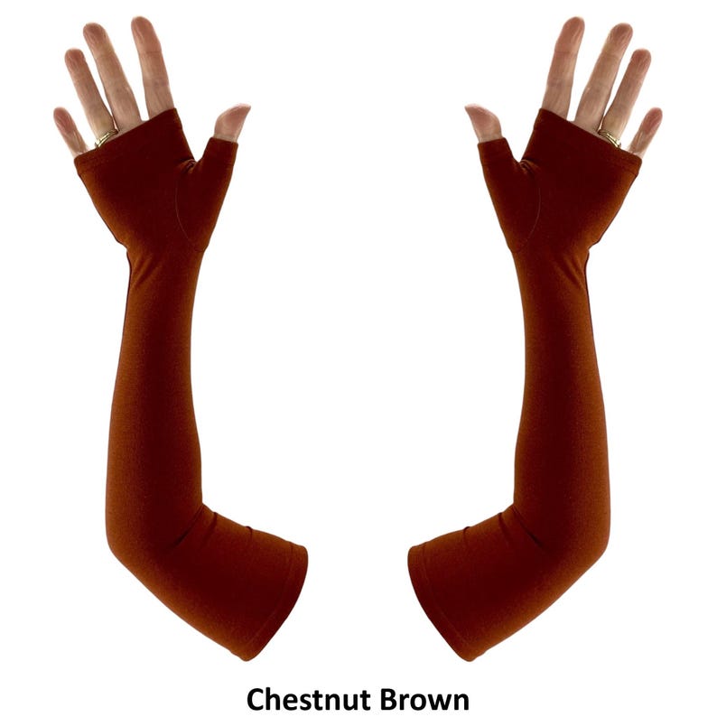 May include: A pair of chestnut brown fingerless arm sleeves that extend from the knuckles to the mid-forearm. The sleeves are made of a solid, smooth fabric and feature an opening for the thumb, leaving the fingers exposed. Text reads Chestnut Brown.