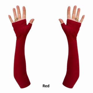 May include: A pair of deep red, long, fingerless gloves that extend past the elbow. The fabric is smooth and solid in colour, covering the forearm and palm while leaving the fingers exposed. The word Red is printed in black text below the gloves.