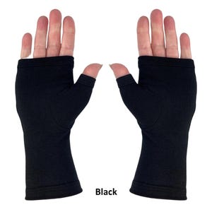 May include: A pair of solid black fingerless gloves featuring a thumb hole and an open-finger design. The gloves extend from the base of the fingers to the wrist, constructed from a smooth, opaque fabric with finished stitched edges at the openings.