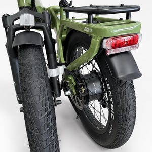 May include: Close-up of a green electric bicycle with black tires. The bike has a rear rack, a red taillight, and the brand name "LECTRIC" on the tire. The front tire is large and has a deep tread.
