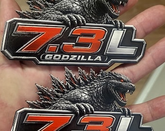 Coppia di emblemi per camion e SUV in acrilico, 5x2,97", con occhio rosso, 7,3 litri.