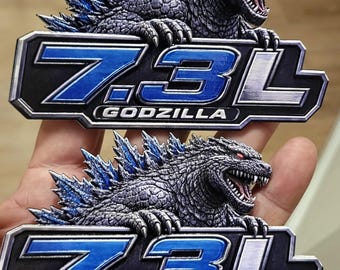 Emblema Godzilla de 7.3L con ojo rojo, emblema texturizado 3D, par de emblemas acrílicos para camionetas y SUV de 5x2.97".