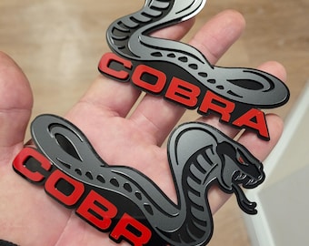 Shelby Cobra-badge glanzend zwart Paar: slangenembleem zijspatbordstickers