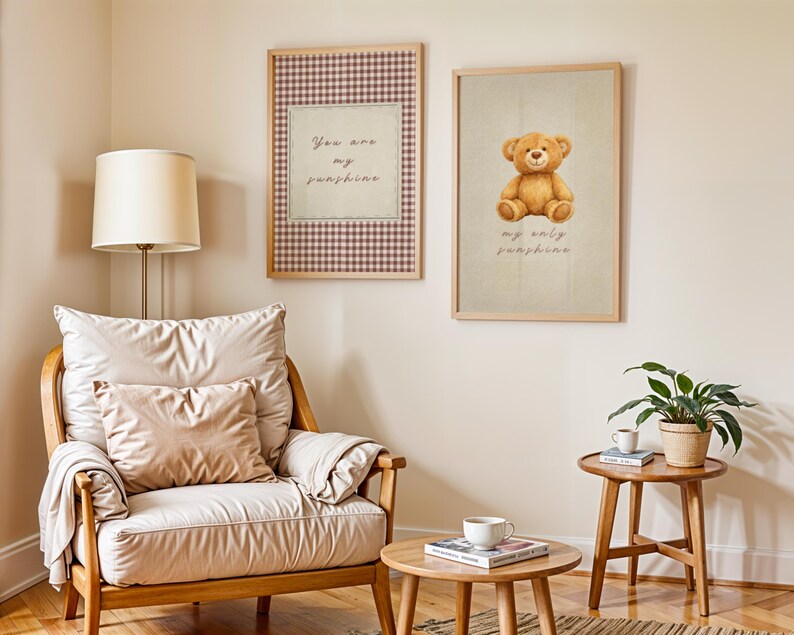 May include: Two framed prints hang on a wall. One features a teddy bear illustration with the text "my only sunshine." The other print has a gingham border and the text "You are my sunshine."