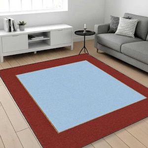 Minimalistisch tweekleurig vloerkleed, modern tapijt met randen, blauw middenrood ingelijst tapijt, eenvoudig eigentijds tapijt, decoratief tapijt woonkamer