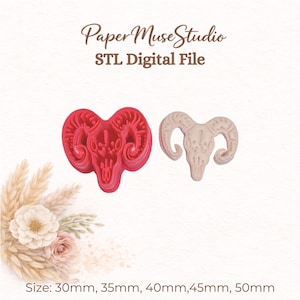 May include: A red ram skull cookie cutter and a beige ram skull impression, with the text Paper Muse Studio STL Digital File and Size: 30mm, 35mm, 40mm, 45mm, 50mm. The design features curved horns and a detailed skull structure for baking.