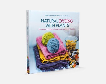 May include: A book titled "Natural Dyeing with Plants" with text and colorful yarn balls and fabrics. The book cover features the title in teal and red, with the subtitle "Glorious Colors from Roots, Leaves & Flowers".