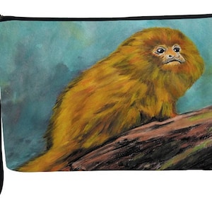 May include: A golden-haired monkey sits on a branch with a blue and green background. The monkey has a fluffy coat and is looking to the right. The monkey is a popular subject for art and nature photography.