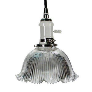 May include: Clear glass pendant light with a ruffled, bell-shaped shade. The light fixture has a white socket and a chrome base. A black cord suspends the light, which is designed for indoor use.