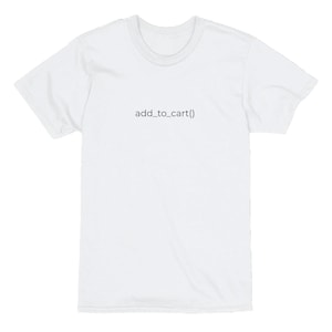 May include: A white t-shirt with the text "add_to_cart()" printed in black. The shirt has a crew neck and short sleeves. The text is centered on the front of the shirt.