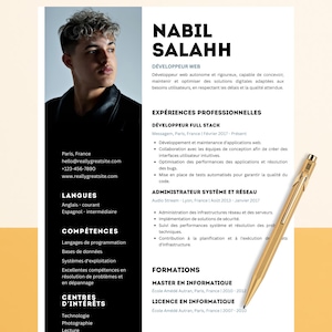 May include: A resume with the name NABIL SALAHH in bold black text. The resume includes sections for professional experience, education, and skills. A gold pen rests on the right side of the resume. The background is a light beige color.
