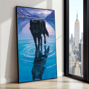 May include: A framed art print depicts a black wolf walking in water, creating ripples. The wolf's reflection is visible. The background shows a lake, mountains, and a sunset. The artwork is displayed near a window with a city view.