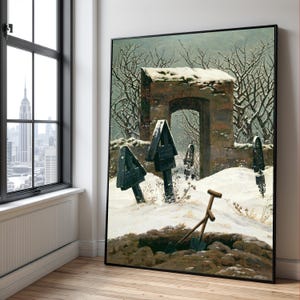 May include: A framed artwork showing a winter cemetery scene. The painting features snow-covered tombstones, a stone archway, and bare trees under a cloudy sky. A shovel rests near an open grave, creating a sombre atmosphere.