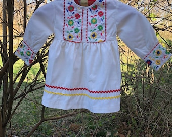 Late 1960s/early 1970s Toddler girl white dress with colorful embroidery