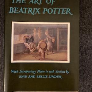 May include: A hardcover book titled "THE ART OF BEATRIX POTTER" with a dark green cover. The book features an illustration of a room with chairs and figures. The text "With Introductory Notes to each Section by ENID AND LESLIE LINDER" is also visible.