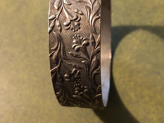 Lily pattern silver tone bangle - image 3