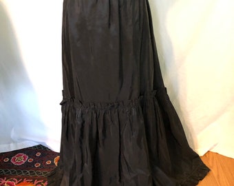 1970s black taffeta floor length skirt with ruffled hemline