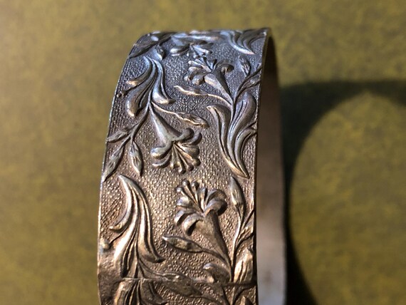 Lily pattern silver tone bangle - image 2