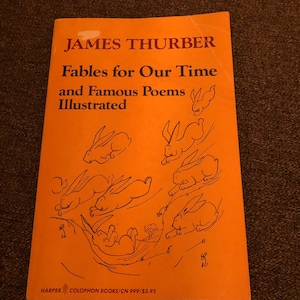 May include: An orange book cover with the title "Fables for Our Time and Famous Poems Illustrated" by James Thurber. The cover features a series of black and white illustrations of rabbits.