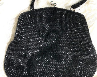 Beautiful early 1960s black wave pattern beaded evening bag