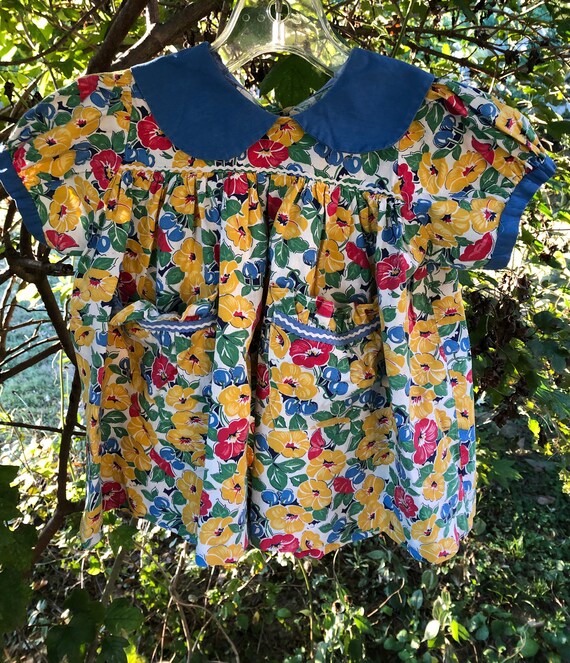 1940s toddler’s brightly colored floral print dres