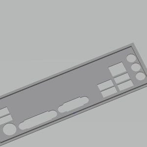 May include: A gray computer component back panel with various rectangular and circular cutouts. The panel has a rectangular shape with a beveled edge and is set against a gray background. The cutouts are for ports and connectors.
