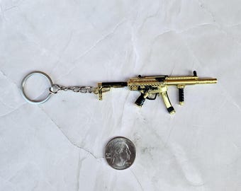 Llavero con réplica de arma, chapado en oro, MP5 SMG, regalo personal o de cumpleaños.
