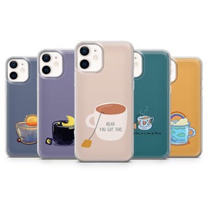 May include: A selection of phone cases with different designs. One case shows a teacup with the words "Relax, You Got This." Other cases feature a cup with a rainbow, a cup with a moon, and a cup with a sun.