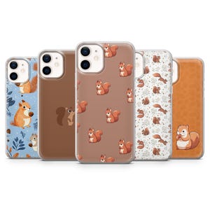 May include: A collection of phone cases featuring various designs. One case has a blue background with a squirrel illustration. Other cases have brown, white, and tan backgrounds with squirrel patterns. The cases are designed to fit a smartphone.